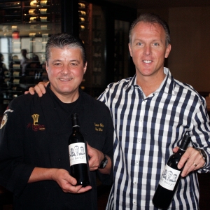 Yvon Goetz and JC Clow with bottles of their special Syrah blend called The Boyz  